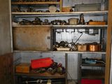 a metal cabinet with lots of tools in it