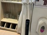 a white towel hanging on the wall next to a wooden table