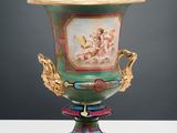 an image of a vase with a painting on it sitting on a table