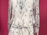 an image of a mannequin dress on a stand against a red background