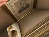 a person that is holding a picture in a box