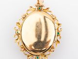 an image of a gold locke with emeralds on it