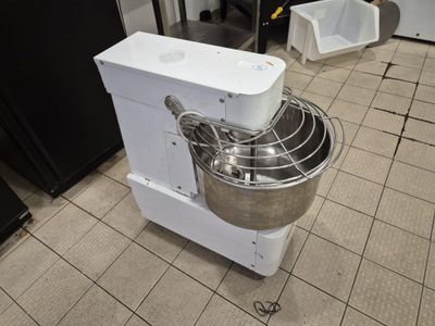 an image of a kitchen with a mixer on the floor