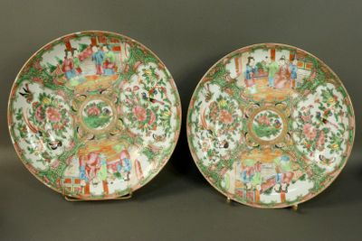pair of chinese famille plates with figures in a landscape