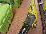 two chainsaws and a tool box on a table