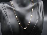 a gold and pearl necklace on a mannequin mannequin mannequin mannequin mannequin mannequin mannequin mannequin mann