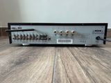 a close up of a stereo amplifier on a wooden floor