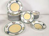 a lot of plates that are sitting on a table
