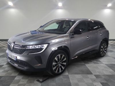 the grey suv is parked on a checkered floor in a garage