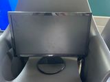 a black chair with a monitor on top of it