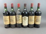 six bottles of wine are lined up in a row
