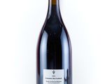 a bottle of wine that is sitting on a table