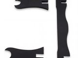 three pieces of black plastic are shown on a white surface