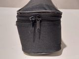 a black bag with a zipper on it sitting on a table