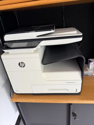 a printer that is sitting on top of a desk