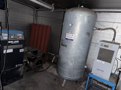 a water heater and other equipment in a garage