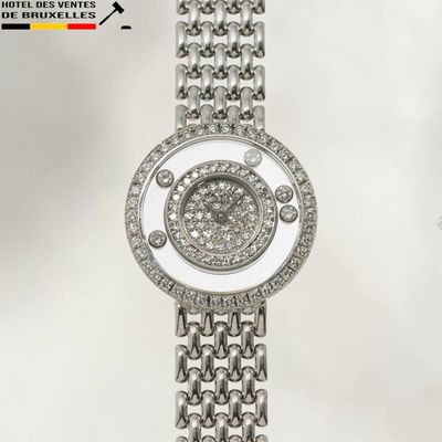 an image of a close up of a wrist watch with diamonds on it