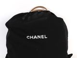 a black bag with the word chanel written on it