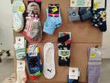 many pairs of socks on a pallet in a room