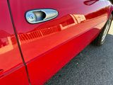 a close up of a car ' s door handle and door handle