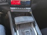 the dashboard of a car with a gps device in the center of it