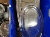 a blue container with a silver toilet and a blue container with a silver toilet