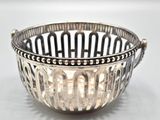 a silver bowl that is sitting on a table