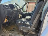 the interior of a truck with the driver ' s seat removed