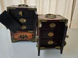 two small chests sitting on a table next to each other