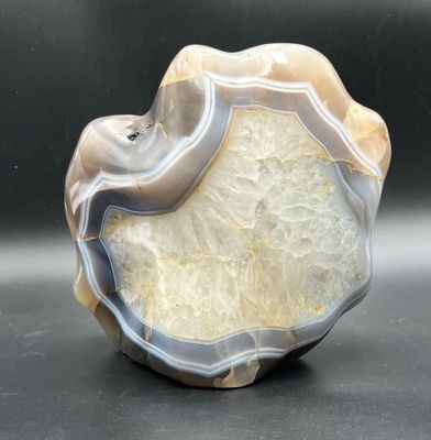 a picture of a piece of agate on a black surface