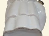 a white vase that has a lid on it