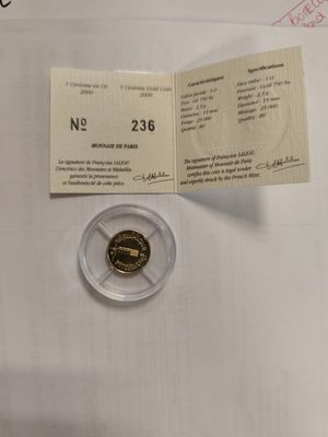 a small piece of gold coin on the table