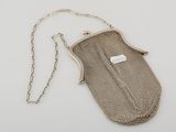 an antique silver mesh purse with chain strap and clasp