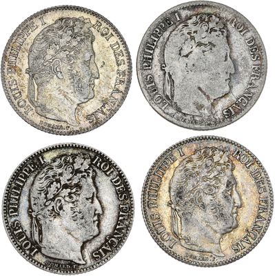 quatre types différents de pièces d'argent, dont l'une représente un buste et l'autre un buste