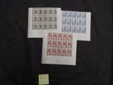 four different stamps on a black cloth with a yellow sticker