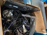 a box full of electronics and wires on the floor