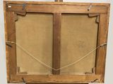 an old wooden easel with a painting hanging on the wall