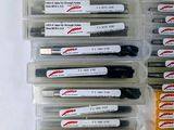 a lot of pens that are sitting in a box