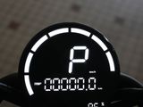 a digital clock on the handlebar of a motorcycle