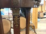 a table that has some chairs and a table on it