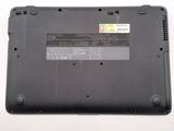 a close up of a laptop with a battery on it