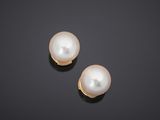 a pair of cultured pearl and diamond earrings