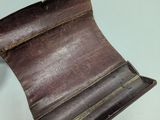 an image of a brown leather wallet sitting on top of a table