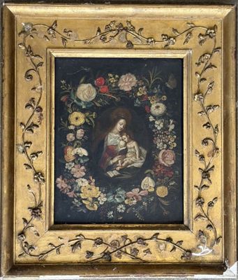 a painting of a woman holding a child in a floral frame