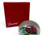 the box is red and white with a rose on it