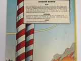 an image of a picture of a book with a lighthouse in the background