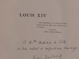 an old book with a handwritten title on it sitting on top of a table