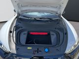 a car with its trunk open and the hood up