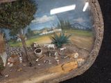 a picture of a picture of a farm scene in a glass case
