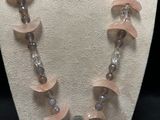 a close up of a necklace on a mannequin display